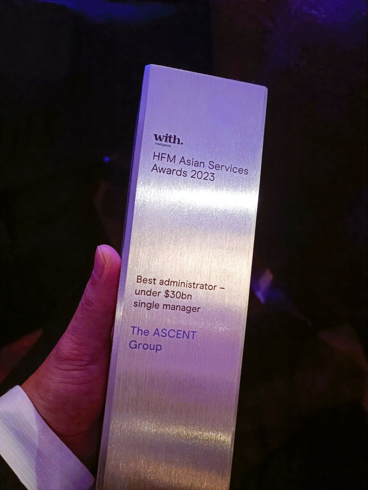 Image of a person holding the HFM Asian Services Award - 'Best Administrator Under 30B Single Manager'